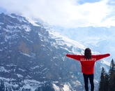 Amanda Horrigan, an alumna who earned a degree in psychology, celebrates after a long hike in the Swiss Alps. Amanda Horrigan, an alumna who earned a degree in psychology, celebrates after a long hike in the Swiss Alps.